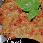 A close up of Greek tomato zucchini fritters