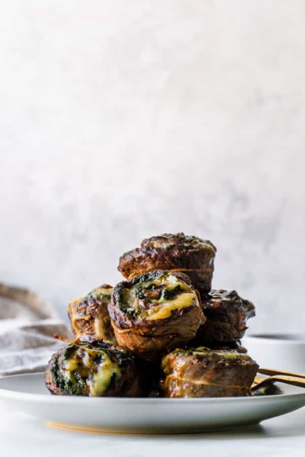 Flank steak stuffed with spinach and havarti on a plate