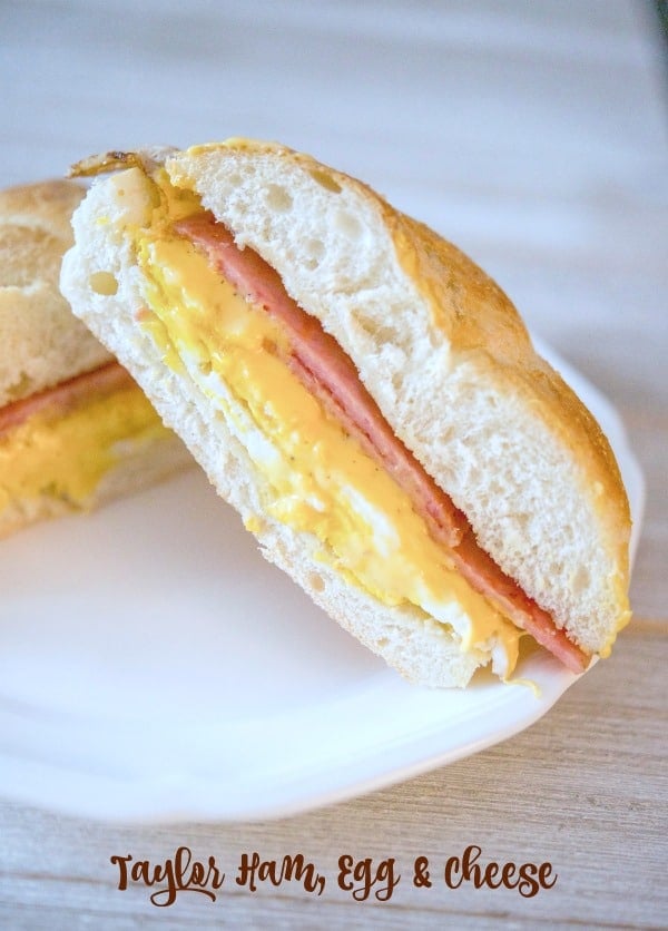 Taylor Ham, Egg and Cheese on a Hard Roll on a white plate. 