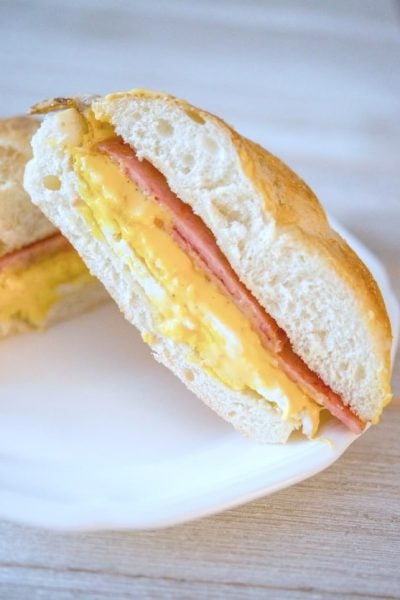 A Taylor Ham, Egg and Cheese sandwich cut in half
