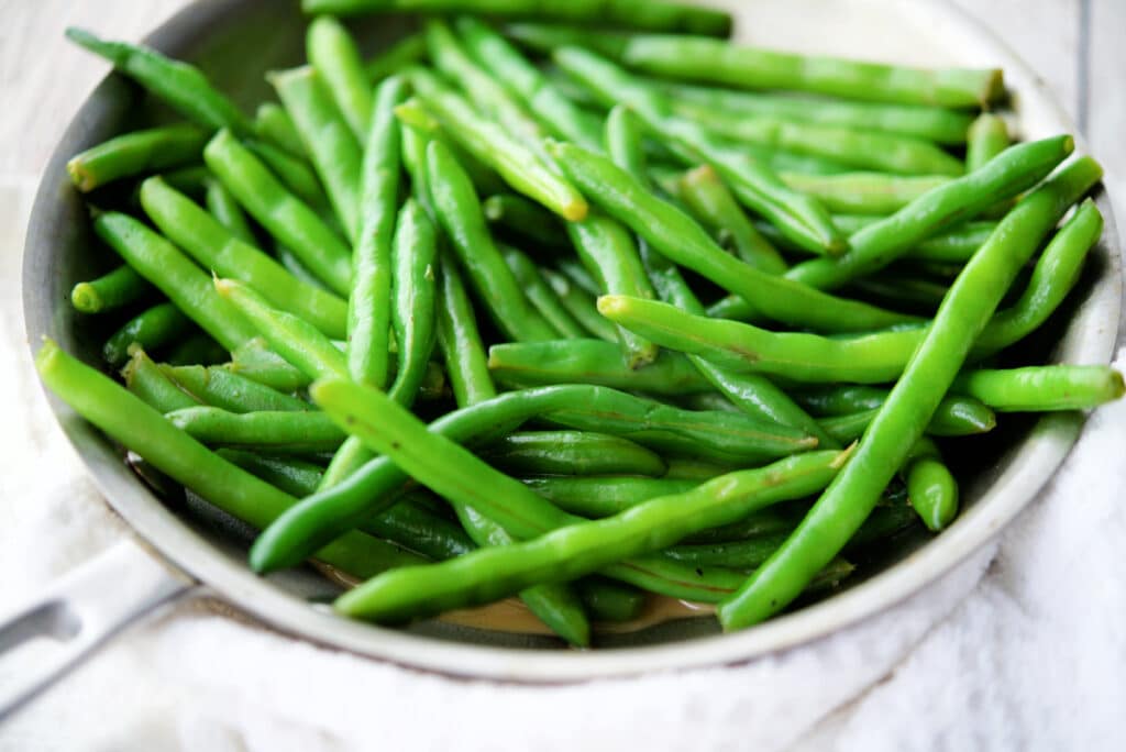 a close up of sautéed green beans