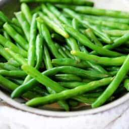 a close up of sautéed green beans