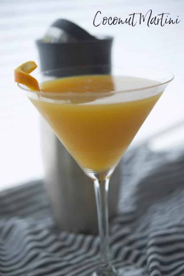 A coconut martini in a martini glass