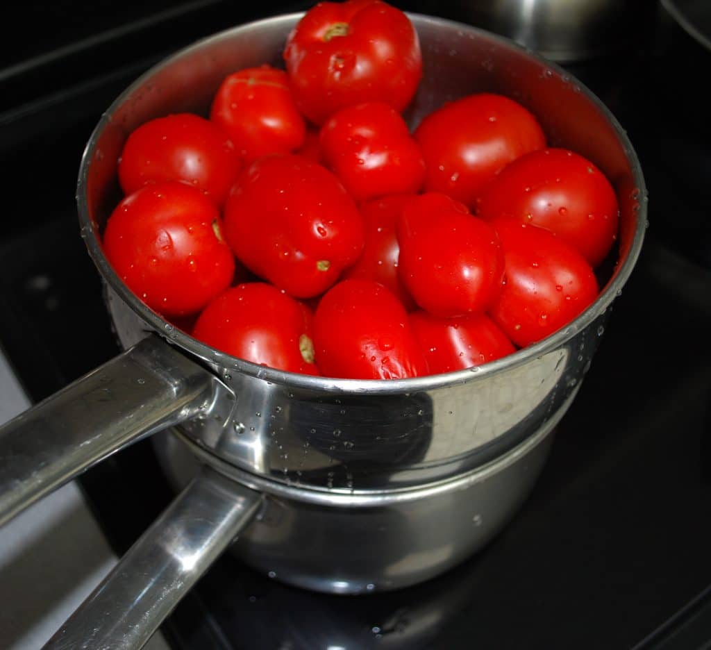 Fresh garden tomatoes in steamer pot