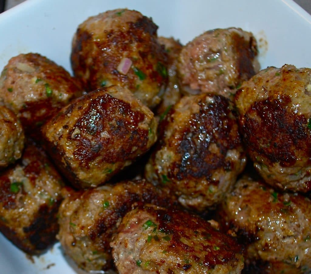 A bowl of cooked meatballs