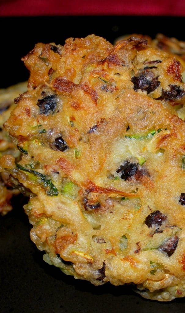 Black beans and freshly grated zucchini combined with garlic, basil and lemon zest into a tasty fritter make a delicious side dish with any meal.