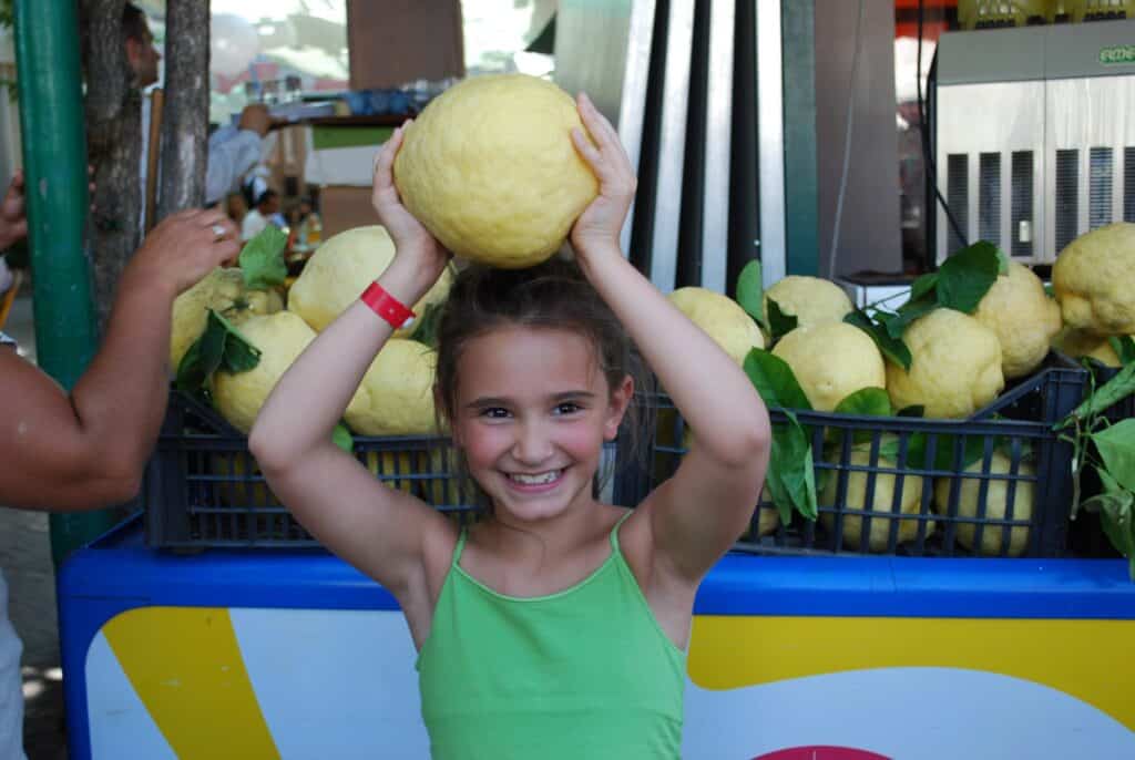 Gabrielle with a large lemon in Sorrento