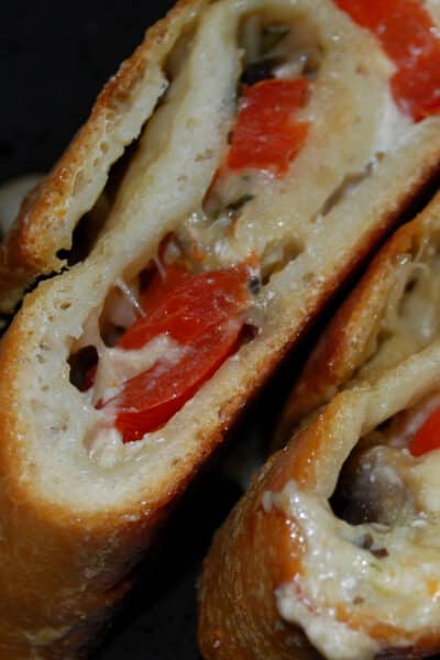 This Mushroom, Tomato and Goat Cheese Stromboli made with pizza dough is super flavorful and perfect for pizza night or game day snacking. 