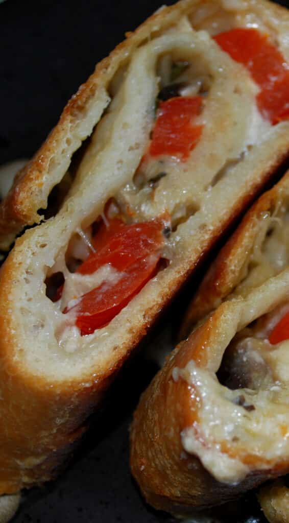 This Mushroom, Tomato and Goat Cheese Stromboli made with pizza dough is super flavorful and perfect for pizza night or game day snacking. 