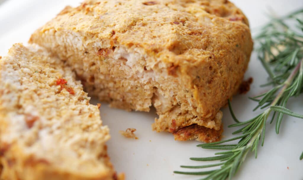 Sun Dried Tomato Turkey Meatloaf on a white board