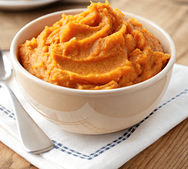 a white bowl with buttermilk mashed sweet potatoes