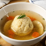 a bowl of matzo ball soup