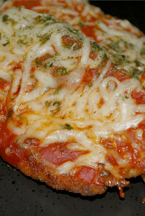 Chicken Parmesan made with breaded and fried boneless chicken breasts topped with your favorite marinara sauce and shredded Mozzarella cheese; then baked until hot and bubbly.