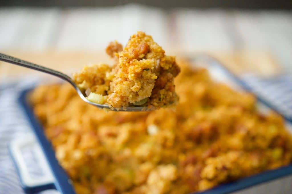 Chorizo Cornbread Stuffing close up on a spoon