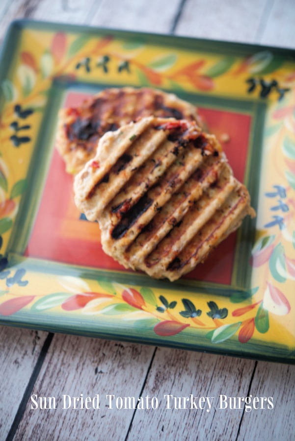 Sun dried tomato turkey burger on a colorful plate
