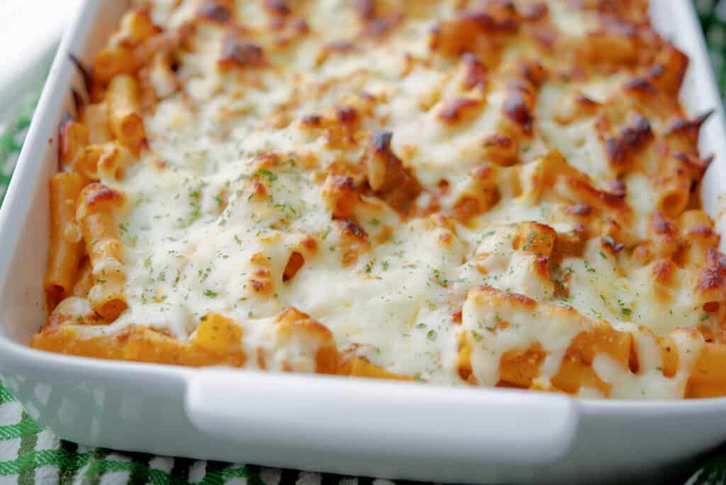 Baked Ziti with Meat Sauce in a white dish