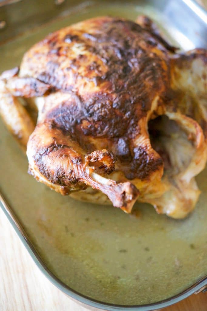 Dijon Balsamic Roasted Chicken in a roasting pan.