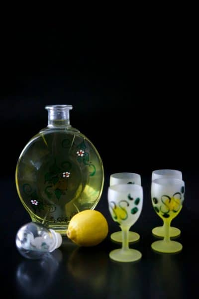 Limoncello in a bottle with shot glasses