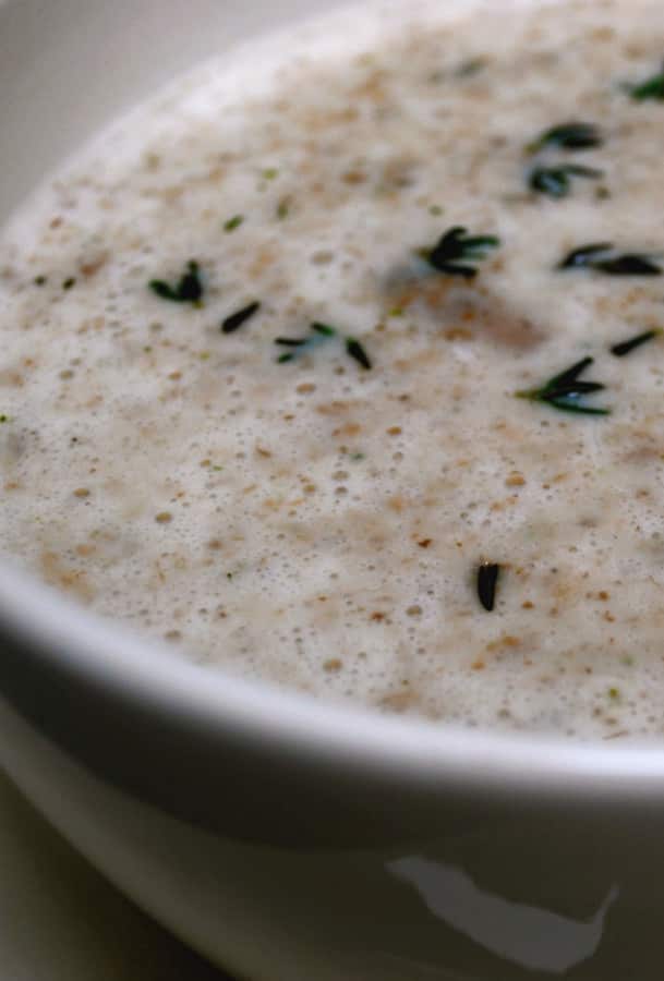 Mushroom and Thyme Soup made with white button mushrooms, onions, fresh thyme, heavy cream and milk is deliciously creamy.