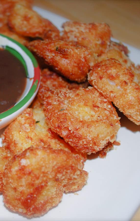 Jumbo shrimp coated in a mixture of potato flakes, orange zest and fresh thyme; then fried until golden brown. 