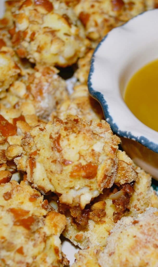 Boneless chicken breasts diced into bite sized pieces then coated with a pretzel crust before baking. 