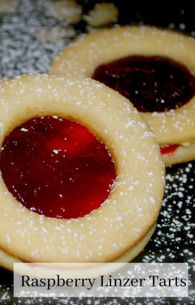 Raspberry Linzer Tarts are one of our favorite holiday treats made with two buttery cookies with tart raspberry preserves spread on the inside. 