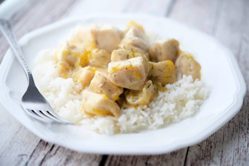 Honey Tangerine Chicken on a plate with a fork