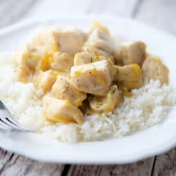 Honey Tangerine Chicken on a plate with a fork