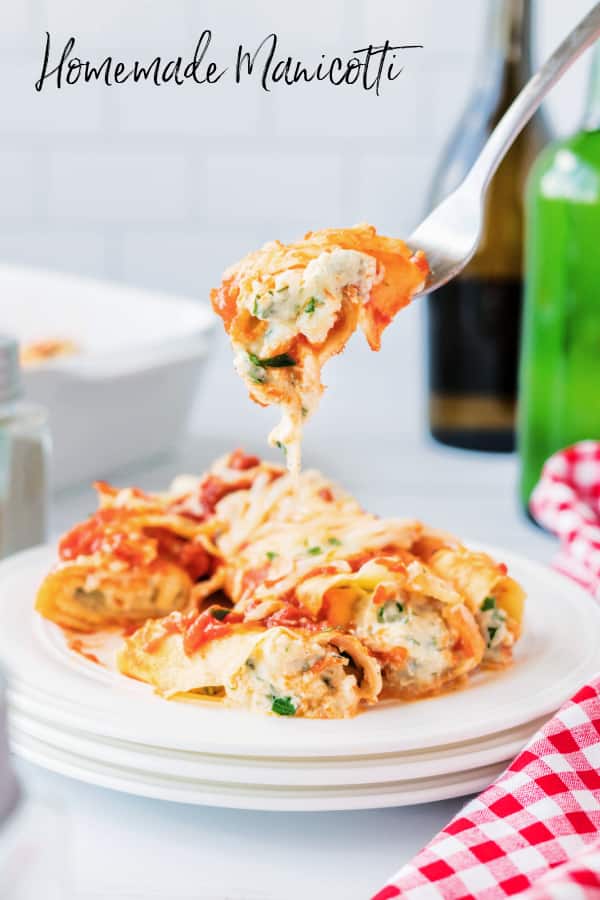 Manicotti on a plate with a fork