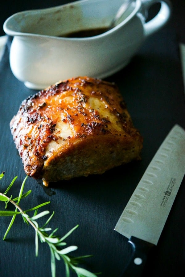 Dijon Maple Roasted Pork Loin on a slate board. 