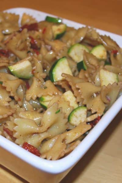 Farfalle pasta tossed with fresh sun dried tomatoes, garden zucchini and red onions in a tangy pomegranate balsamic vinaigrette.