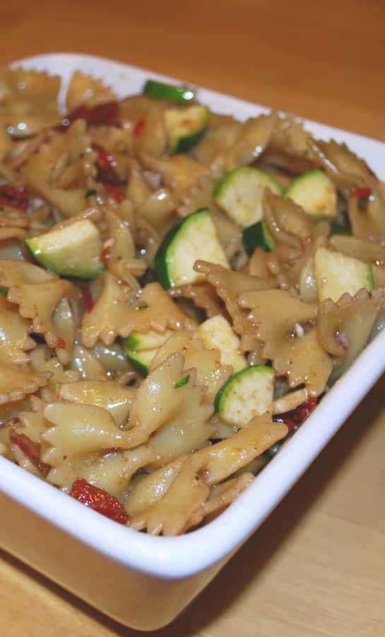 Farfalle pasta tossed with fresh sun dried tomatoes, garden zucchini and red onions in a tangy pomegranate balsamic vinaigrette.