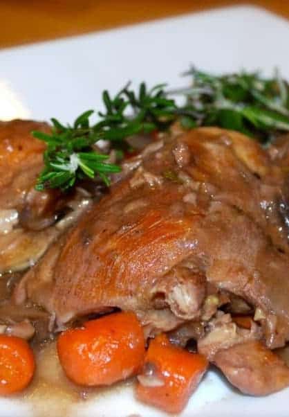 A close up of coq au vin. 