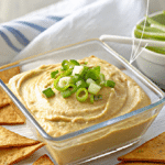 hummus with leeks in a dish
