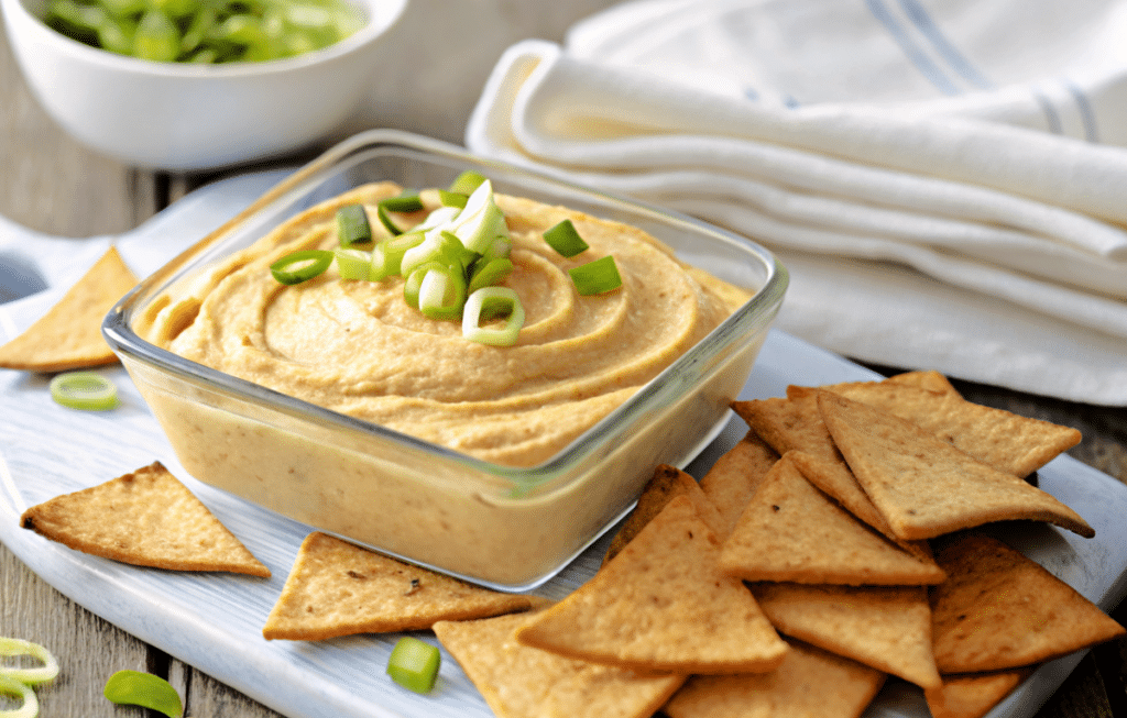 a close up of a dish of hummus