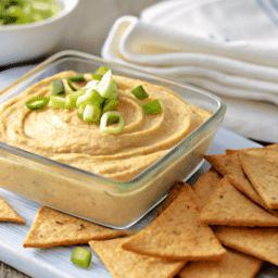 a close up of a dish of hummus