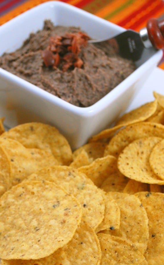 Hummus made with black beans, garlic, Kalamata olives and extra virgin olive oil is a healthy snack that's packed with flavor. 