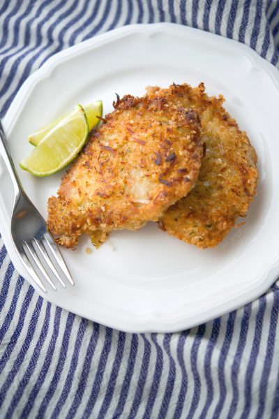 Coconut Lime Pork Cutlets on a plate with a fork