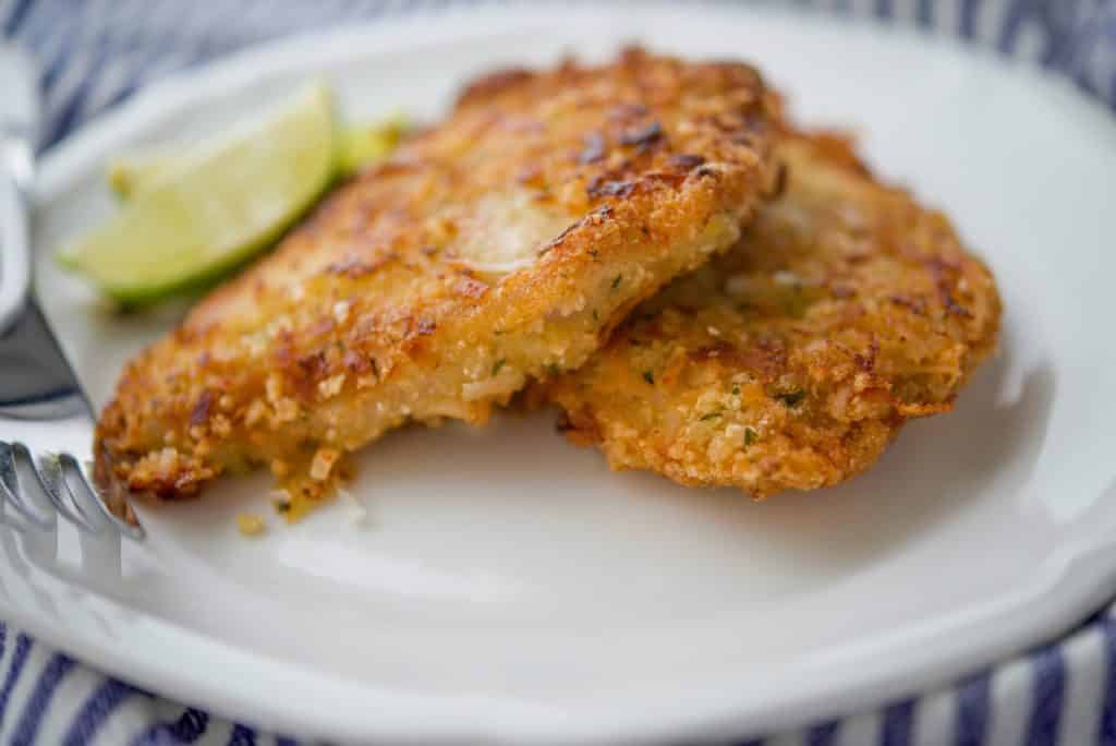 Coconut and Lime Pork Cutlets on a white plate