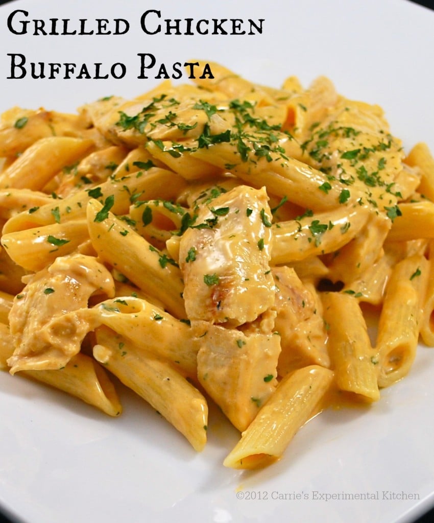 a plate of pasta and chicken with buffalo sauce