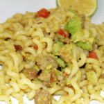 Guacamole Pasta with Sausage on a plate