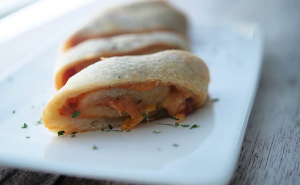 Pizza Stromboli on a white plate