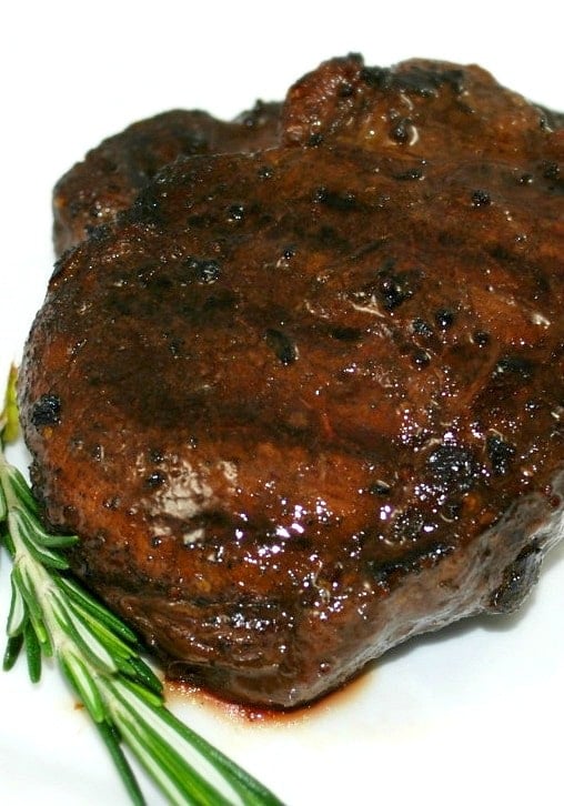 A close up of filet mignon on a plate.