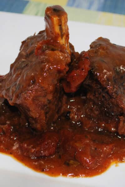 These Beef Short ribs slowly cooked in a fragrant Sun Dried Tomato BBQ Sauce are fall off the bone tender and delicious!