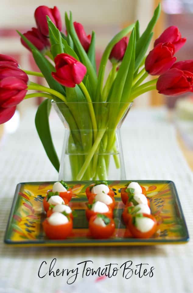 A vase filled with pink flowers on a table and Cherry Tomato Bites