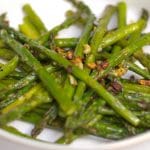 Fresh asparagus tossed with garlic, extra virgin olive oil, Kosher salt and fresh ground pepper; then roasted until caramelized.