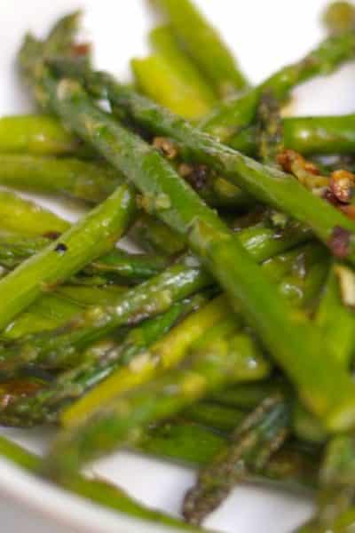 Fresh asparagus tossed with garlic, extra virgin olive oil, Kosher salt and fresh ground pepper; then roasted until caramelized.