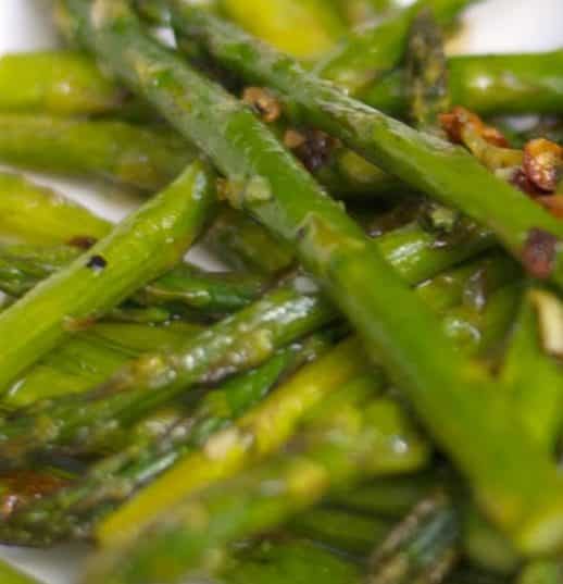 Fresh asparagus tossed with garlic, extra virgin olive oil, Kosher salt and fresh ground pepper; then roasted until caramelized.