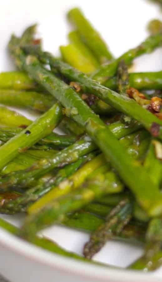 Fresh asparagus tossed with garlic, extra virgin olive oil, Kosher salt and fresh ground pepper; then roasted until caramelized.