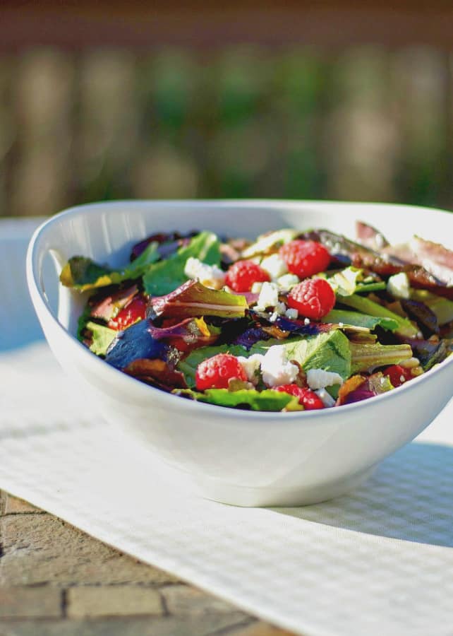 Organic mixed greens tossed with fresh raspberries, buttery pecans and crumbled Feta cheese topped with a raspberry vinaigrette. 